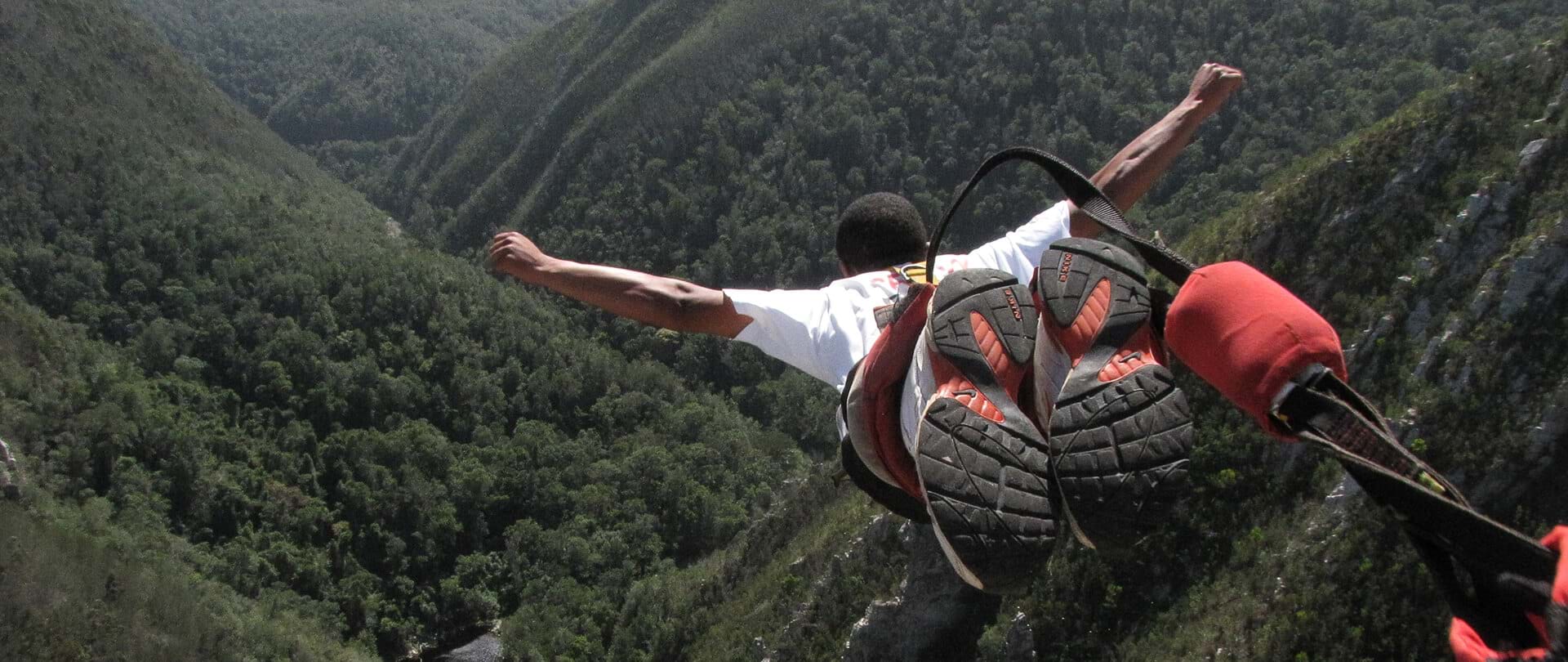 First person view of a bungy jumper falling from Bloukrans Bridge above the gorge