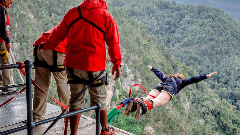 Face Adrenalin crew member watching a jumper leap from the Bloukrans Bridge platform