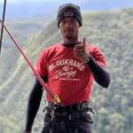 Face Adrenalin crew member in a jump harness on Bloukrans Bridge with the gorge behind