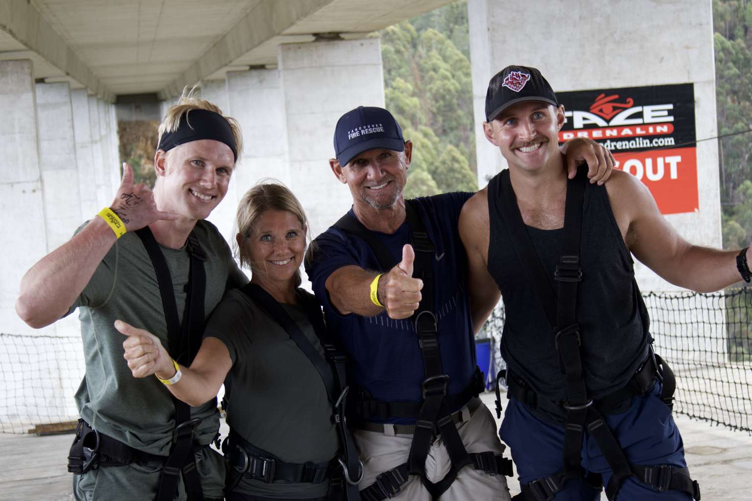 Jumpers and Face Adrenalin crew giving a thumbs up at check in