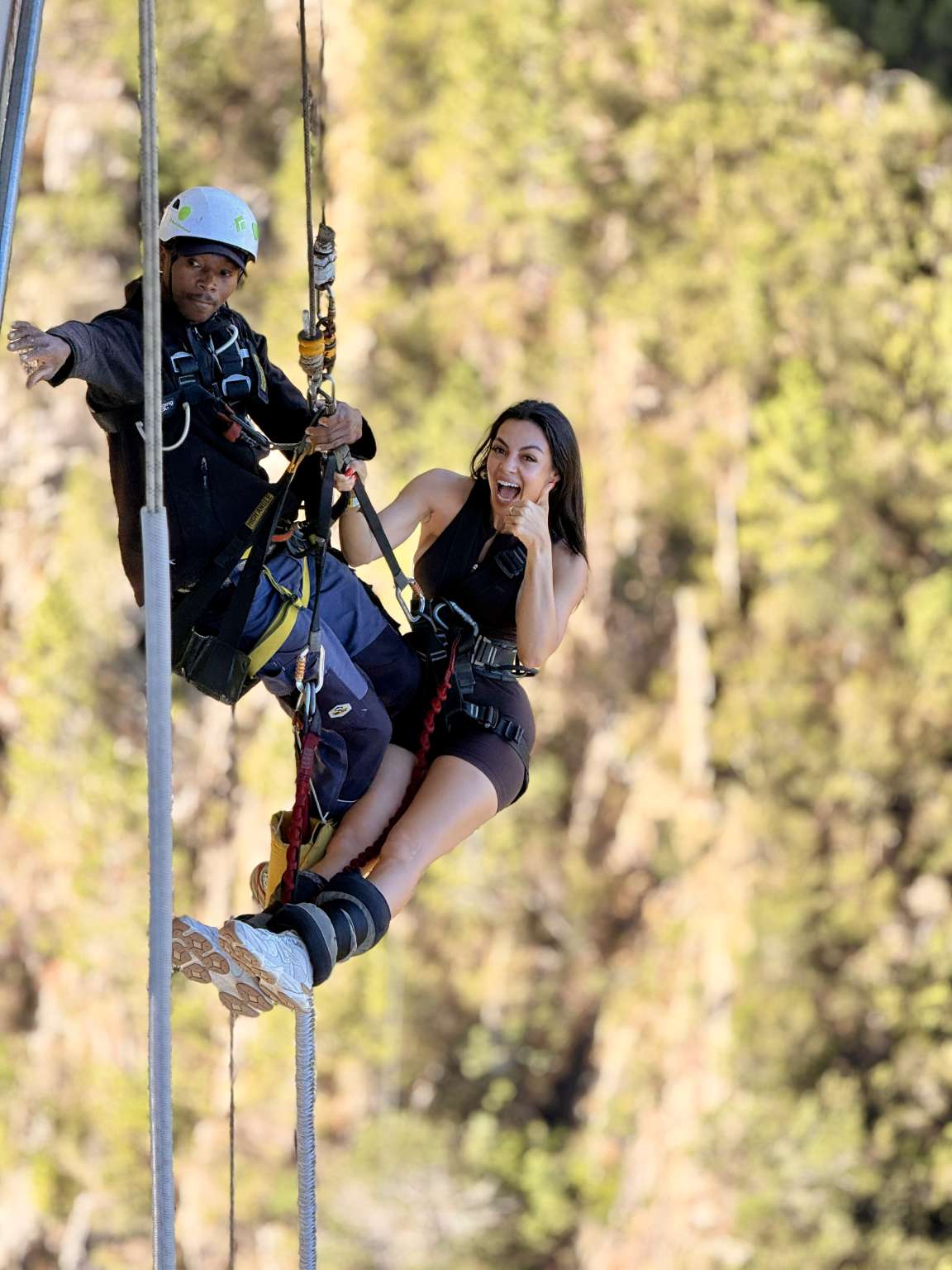 Crew member winching a jumper back up to the platform after a bungy jump at Bloukrans Bridge