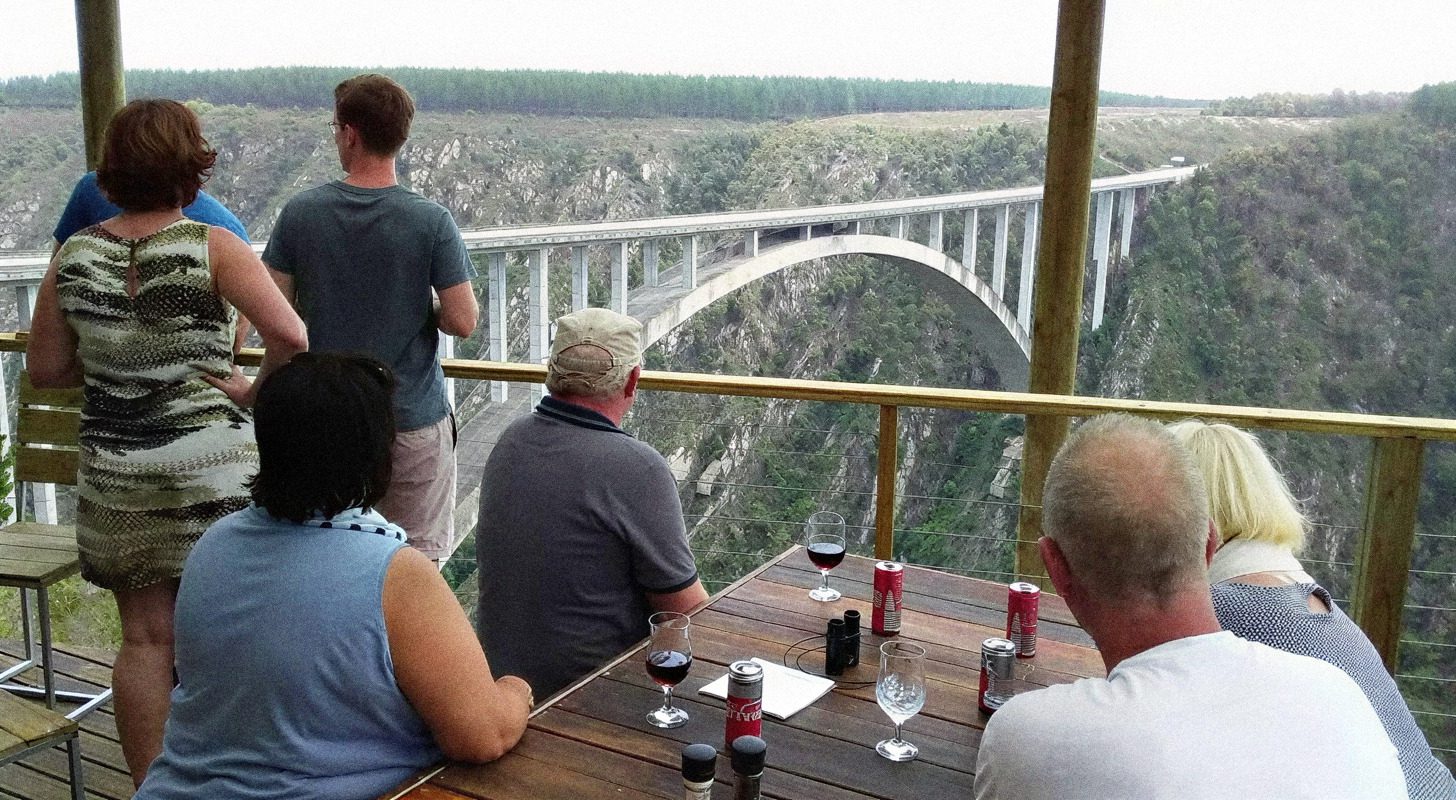 Visitors at the viewing deck looking across the gorge to the Bloukrans Bridge arch
